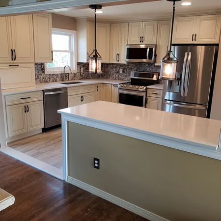 Bright bayport ny kitchen remodel with quartz counters and a tan island
